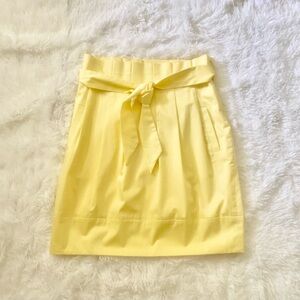 BCBG yellow pleated skirt with tie-waist belt